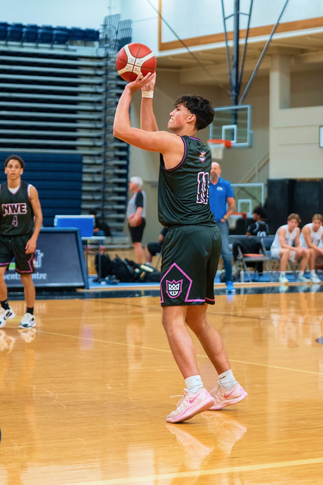 New West Elite player shooting a free throw in a branded jersey