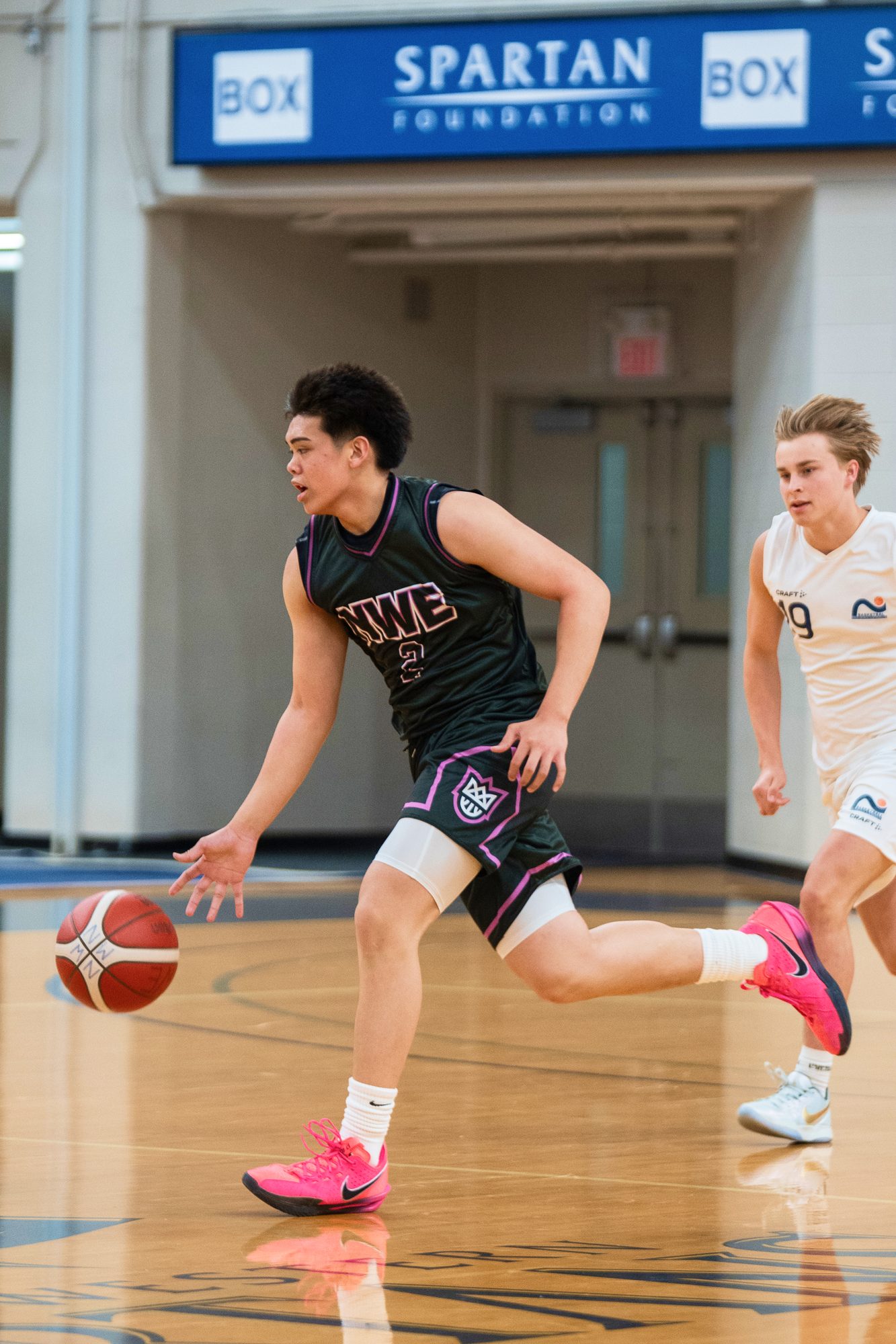New West Elite player dribbling downcourt in a game